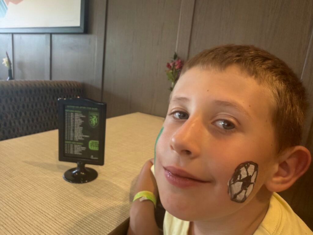 Boy with soccer tattoo. Motor skills improve soccer. 